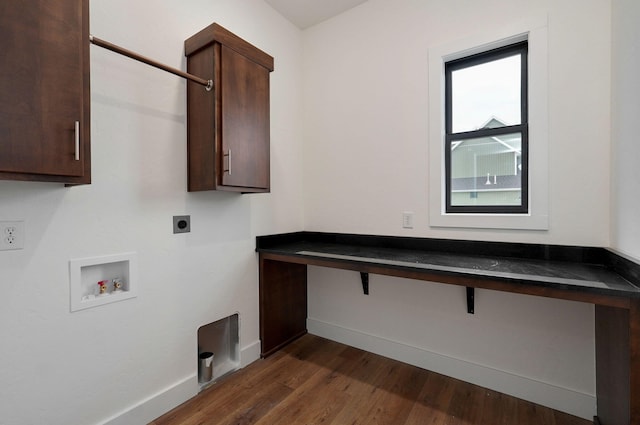 clothes washing area featuring hookup for an electric dryer, dark hardwood / wood-style floors, hookup for a washing machine, and cabinets