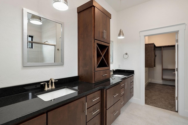 bathroom with vanity and a shower with shower door