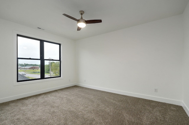 carpeted empty room with ceiling fan