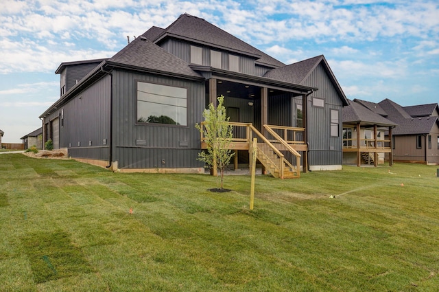 back of house with a yard and a wooden deck