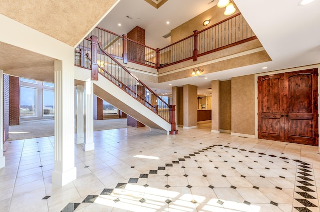 20478 Lawrence Unit 2180, Aurora, MO 65605 - interior space featuring baseboards, a high ceiling, stairs, and light tile patterned floors