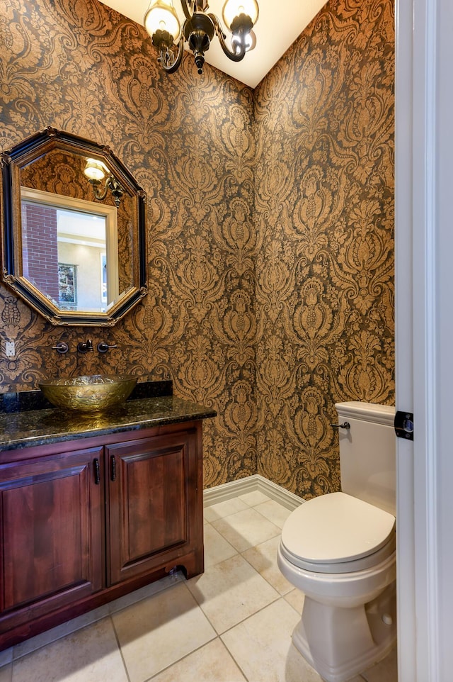 20478 Lawrence Unit 2180, Aurora, MO 65605 - half bathroom with wallpapered walls, tile patterned floors, toilet, vanity, and a chandelier