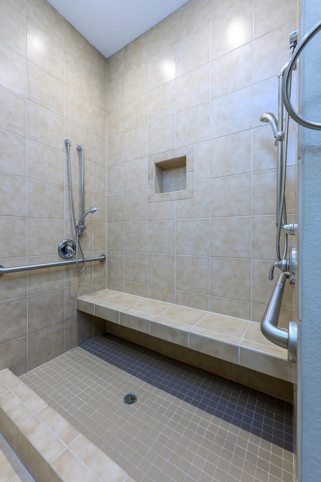 bathroom with a tile shower