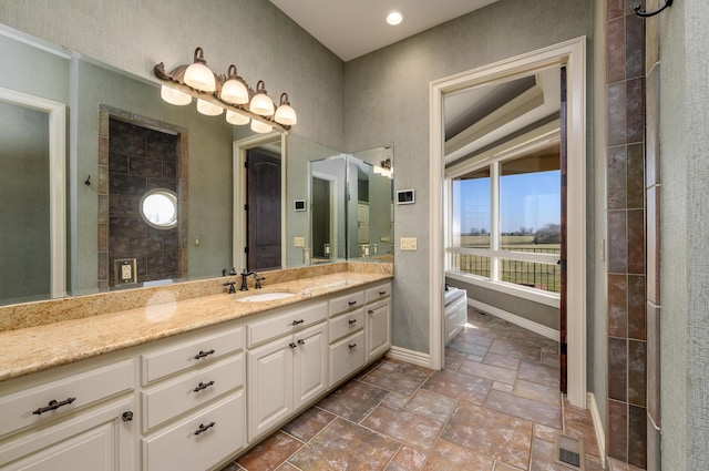 20478 Lawrence Unit 2180, Aurora, MO 65605 - full bath featuring visible vents, baseboards, stone tile flooring, and vanity