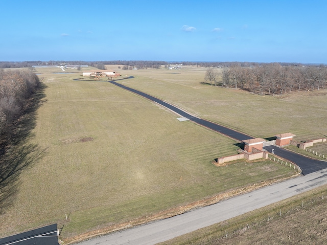 birds eye view of property featuring a rural view