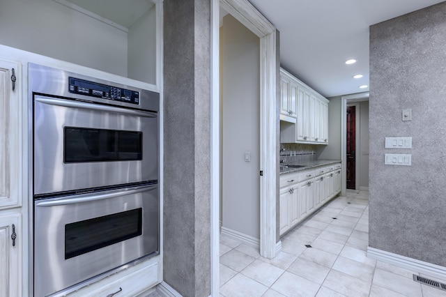 20478 Lawrence Unit 2180, Aurora, MO 65605 - kitchen with double oven, light tile patterned floors, white cabinetry, and recessed lighting