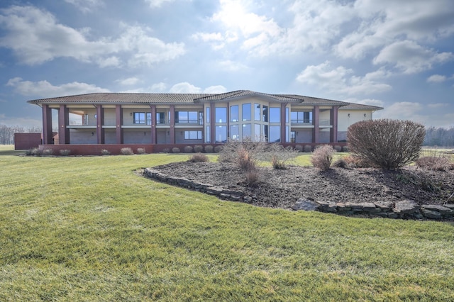20478 Lawrence Unit 2180, Aurora, MO 65605 - rear view of house featuring a yard and stucco siding
