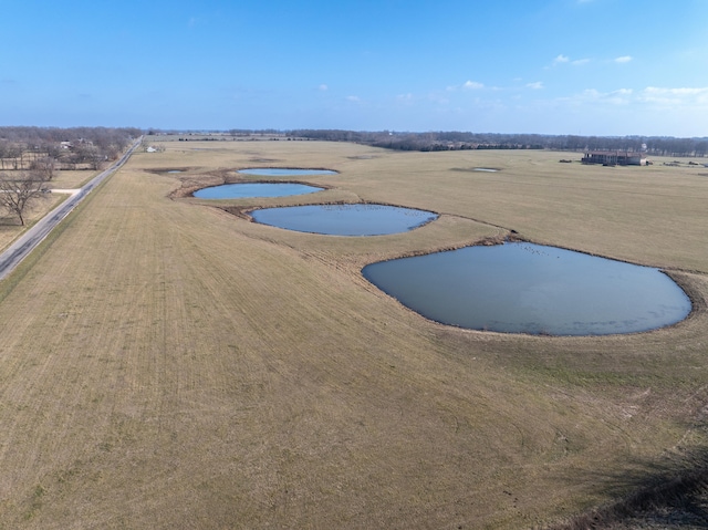 view of pool with a rural view