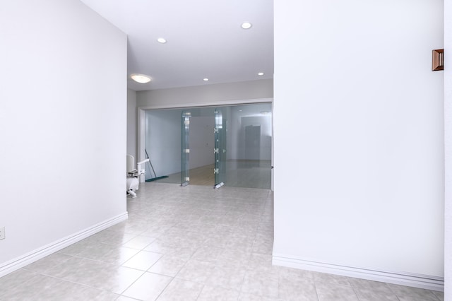 hallway with light tile patterned floors