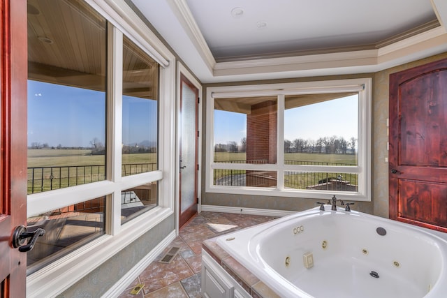 bathroom with a rural view, crown molding, and a relaxing tiled tub