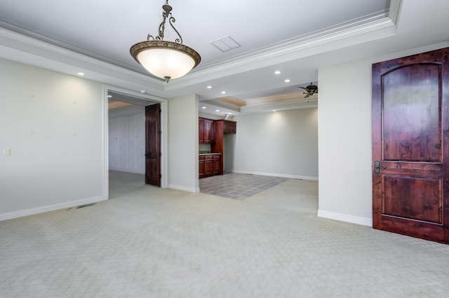 20478 Lawrence Unit 2180, Aurora, MO 65605 - empty room featuring a tray ceiling, visible vents, light colored carpet, ceiling fan, and crown molding
