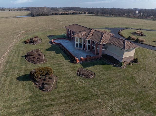 birds eye view of property featuring a rural view