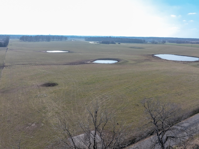 birds eye view of property featuring a rural view