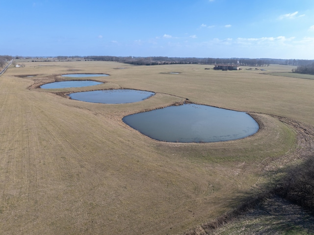 view of pool with a rural view