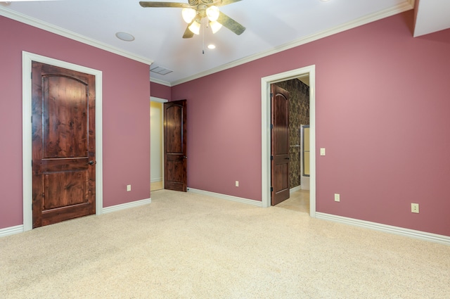 unfurnished bedroom with ceiling fan, crown molding, and light carpet