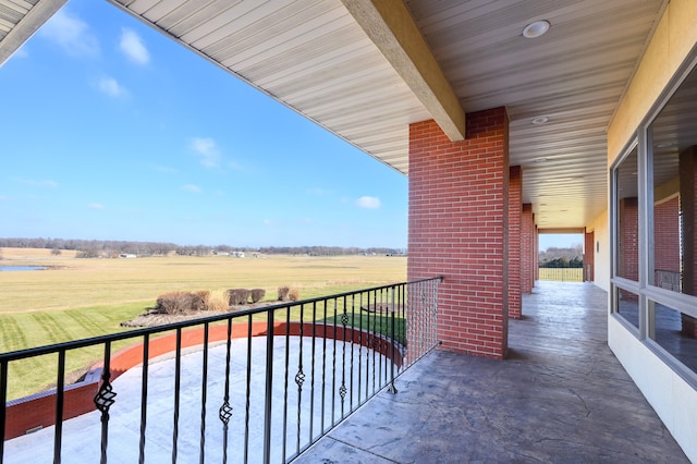 balcony featuring a rural view