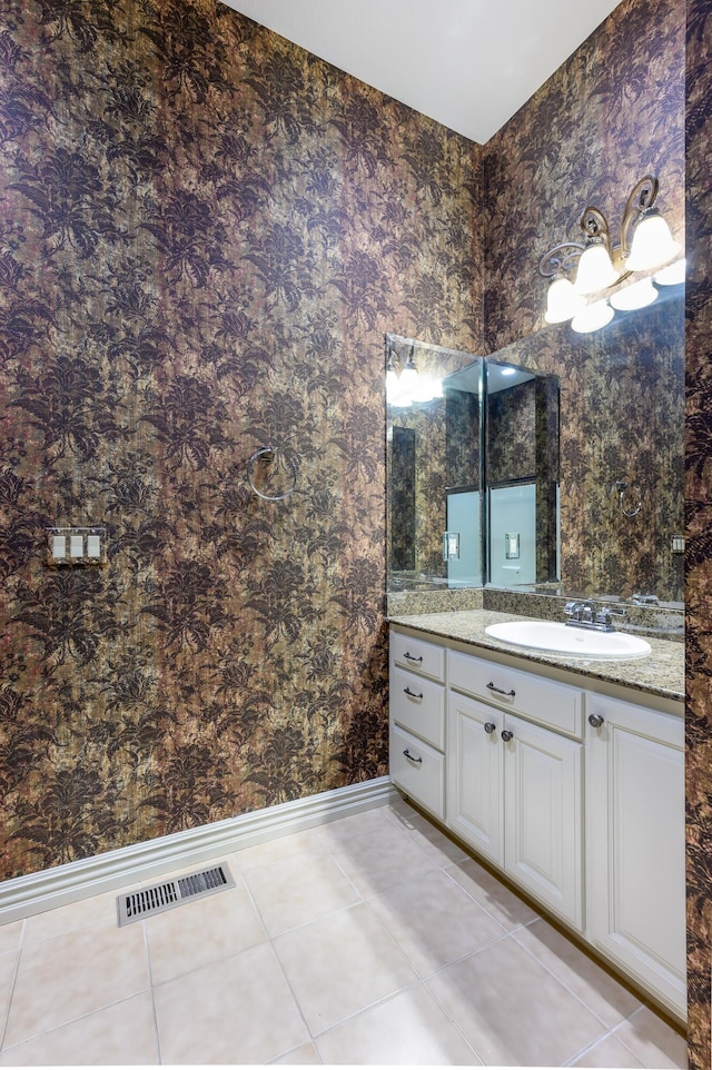 20478 Lawrence Unit 2180, Aurora, MO 65605 - bathroom featuring baseboards, visible vents, wallpapered walls, tile patterned flooring, and vanity