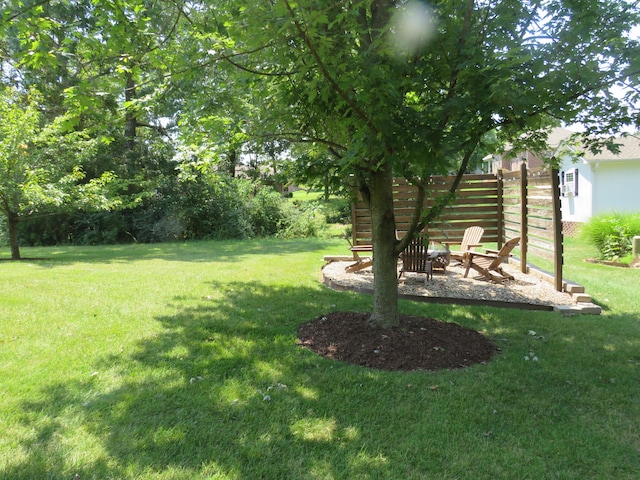 view of yard with a fire pit