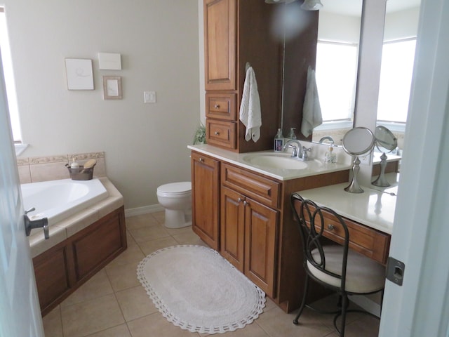 bathroom with tile patterned floors, toilet, a bathtub, and vanity