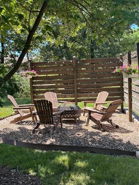 view of patio / terrace with an outdoor fire pit