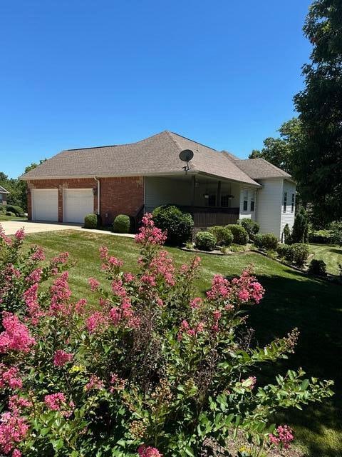 exterior space with a garage and a yard