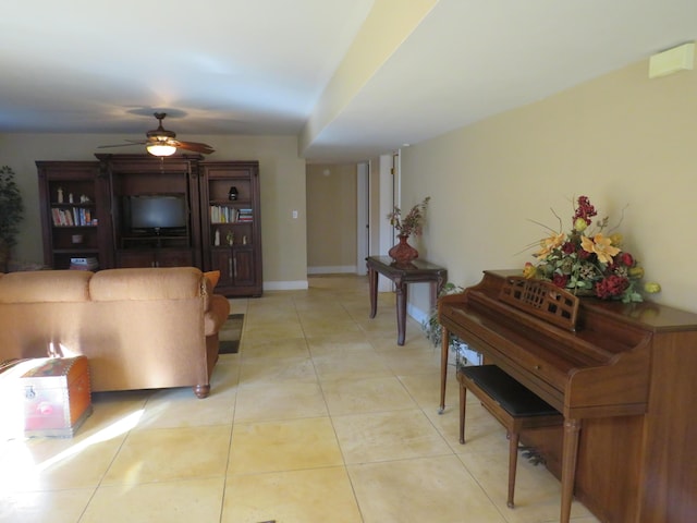 tiled living room featuring ceiling fan