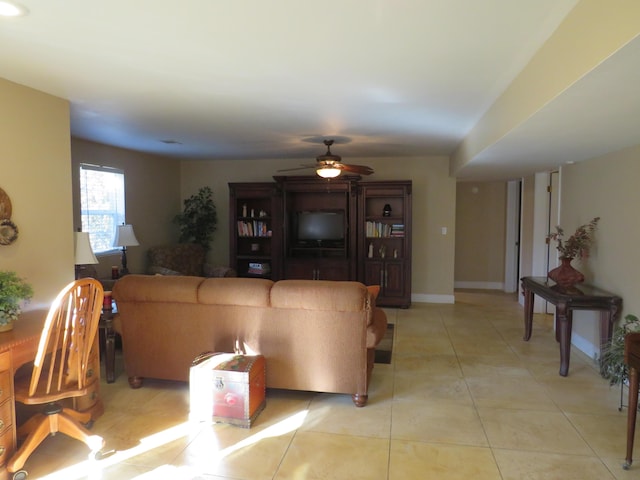 tiled living room featuring ceiling fan