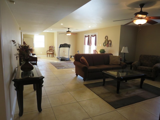 living room with light tile patterned flooring and a healthy amount of sunlight