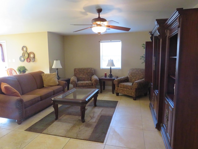 living room featuring light tile patterned flooring and ceiling fan