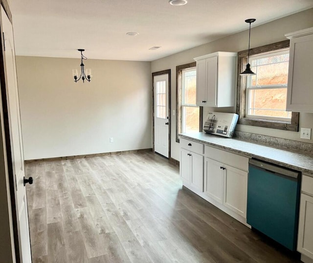 kitchen with dishwasher, a chandelier, wood finished floors, and decorative light fixtures