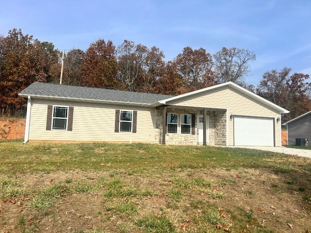 ranch-style house featuring concrete driveway, stone siding, roof with shingles, a front yard, and a garage