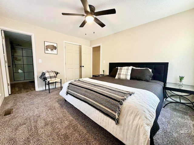 carpeted bedroom with visible vents and ceiling fan