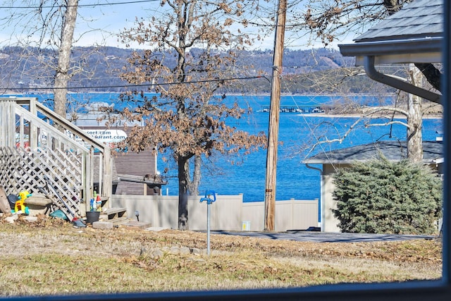 view of water feature featuring fence and a mountain view