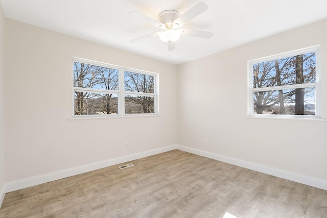 unfurnished room featuring ceiling fan and light wood-type flooring