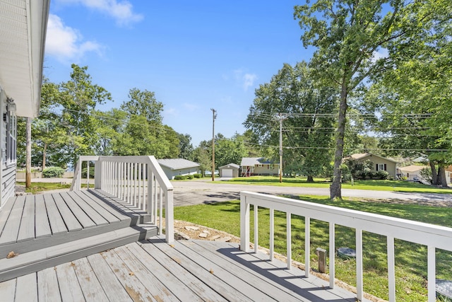 wooden deck with a lawn