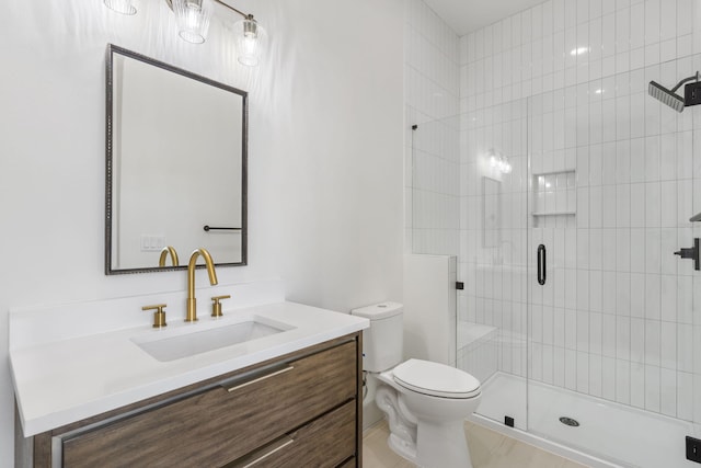 bathroom featuring walk in shower, vanity, and toilet