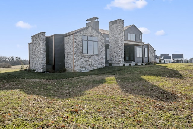 view of property exterior with a lawn and central AC unit