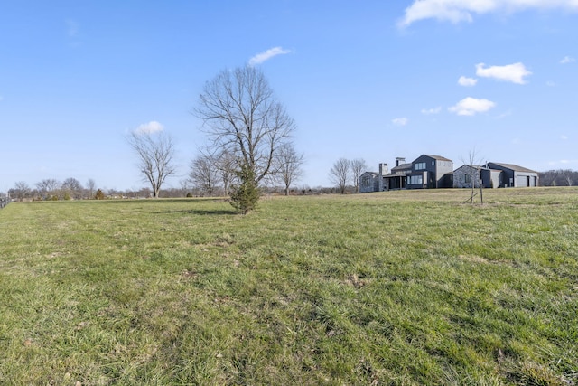 view of yard with a rural view