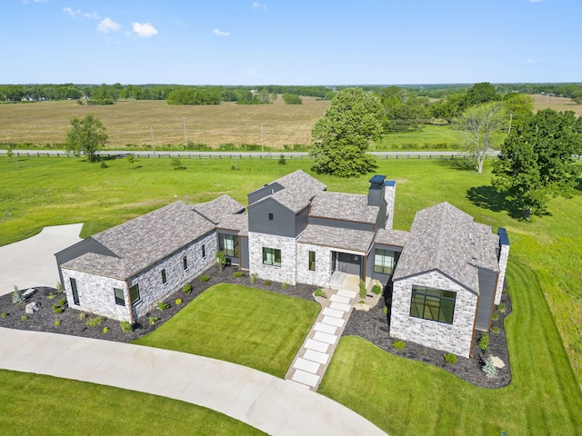 birds eye view of property featuring a rural view