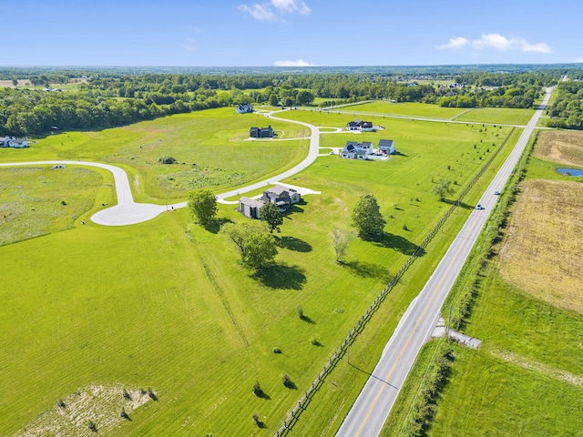 birds eye view of property featuring a rural view