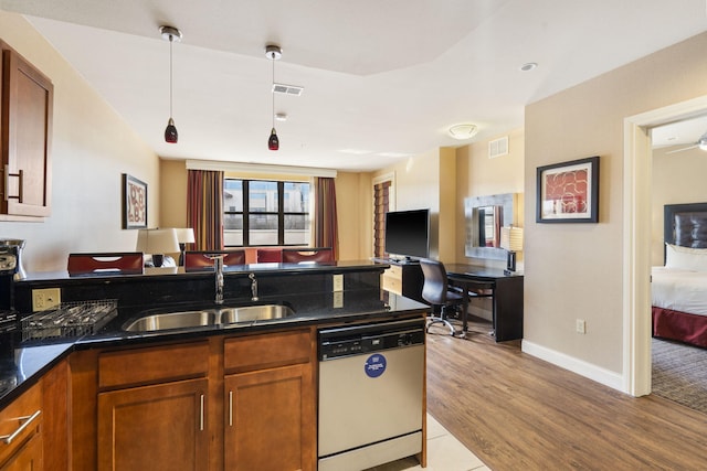 kitchen with ceiling fan, sink, hanging light fixtures, light hardwood / wood-style flooring, and dishwasher