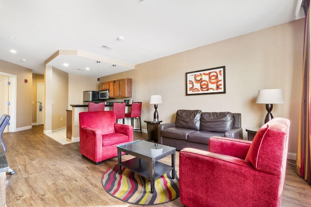 living room with light hardwood / wood-style floors