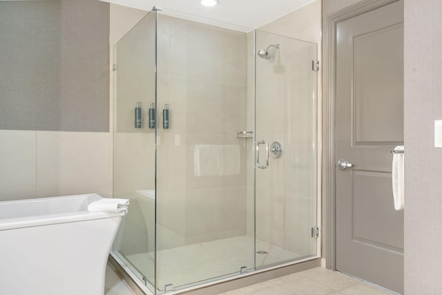 bathroom featuring tile patterned flooring and a shower with door