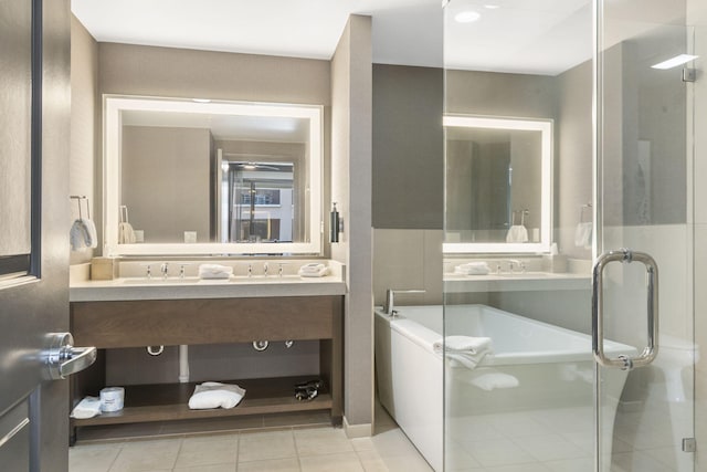 bathroom featuring vanity, shower with separate bathtub, and tile patterned flooring