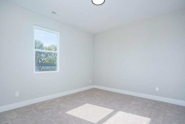 unfurnished room featuring carpet