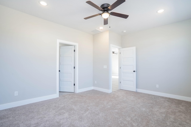 unfurnished bedroom featuring ceiling fan and light colored carpet