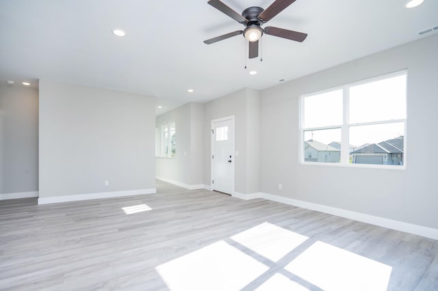 unfurnished room with light hardwood / wood-style floors and ceiling fan