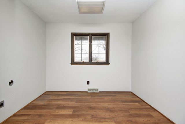 unfurnished room with dark hardwood / wood-style floors