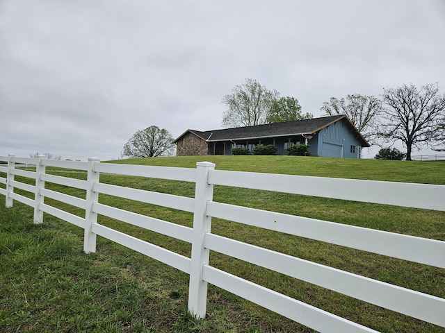 view of gate featuring a yard