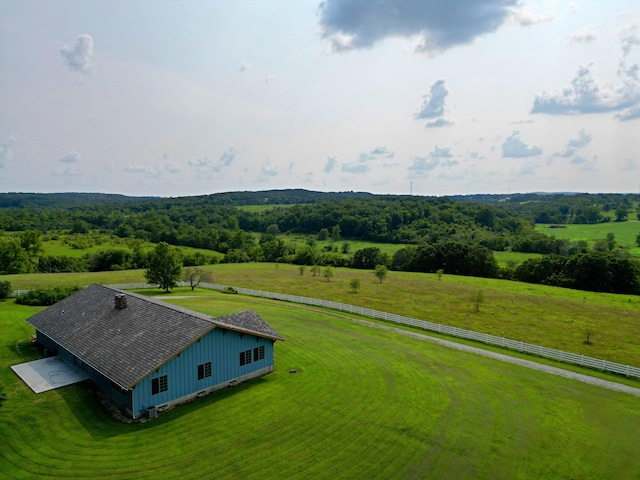 birds eye view of property with a rural view